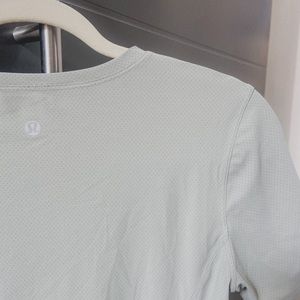 Lululemon tennis shirt with mesh details.